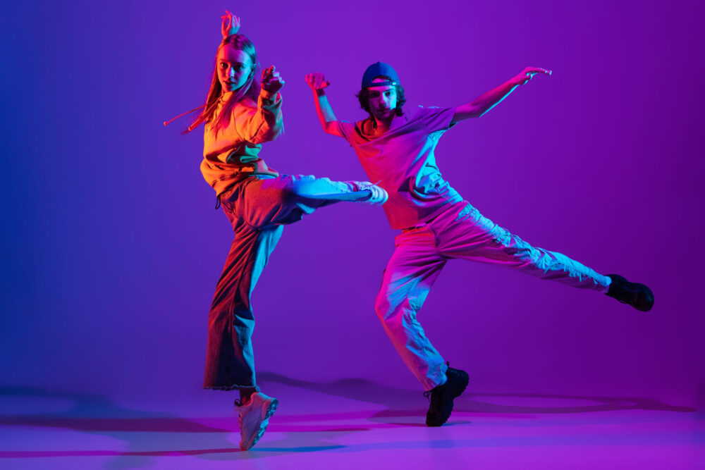 two-dancers-young-man-and-woman-dancing-hip-hop-i-2021-12-09-16-11-52-utc-scaled-e1681741492544
